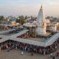 Shirdi Thursday crowd of pilgrims queuing outside the white Samadhi Mandir temple